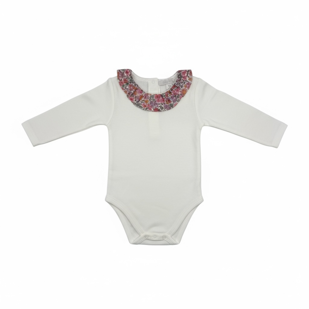White baby onesie with a floral collar on a white background