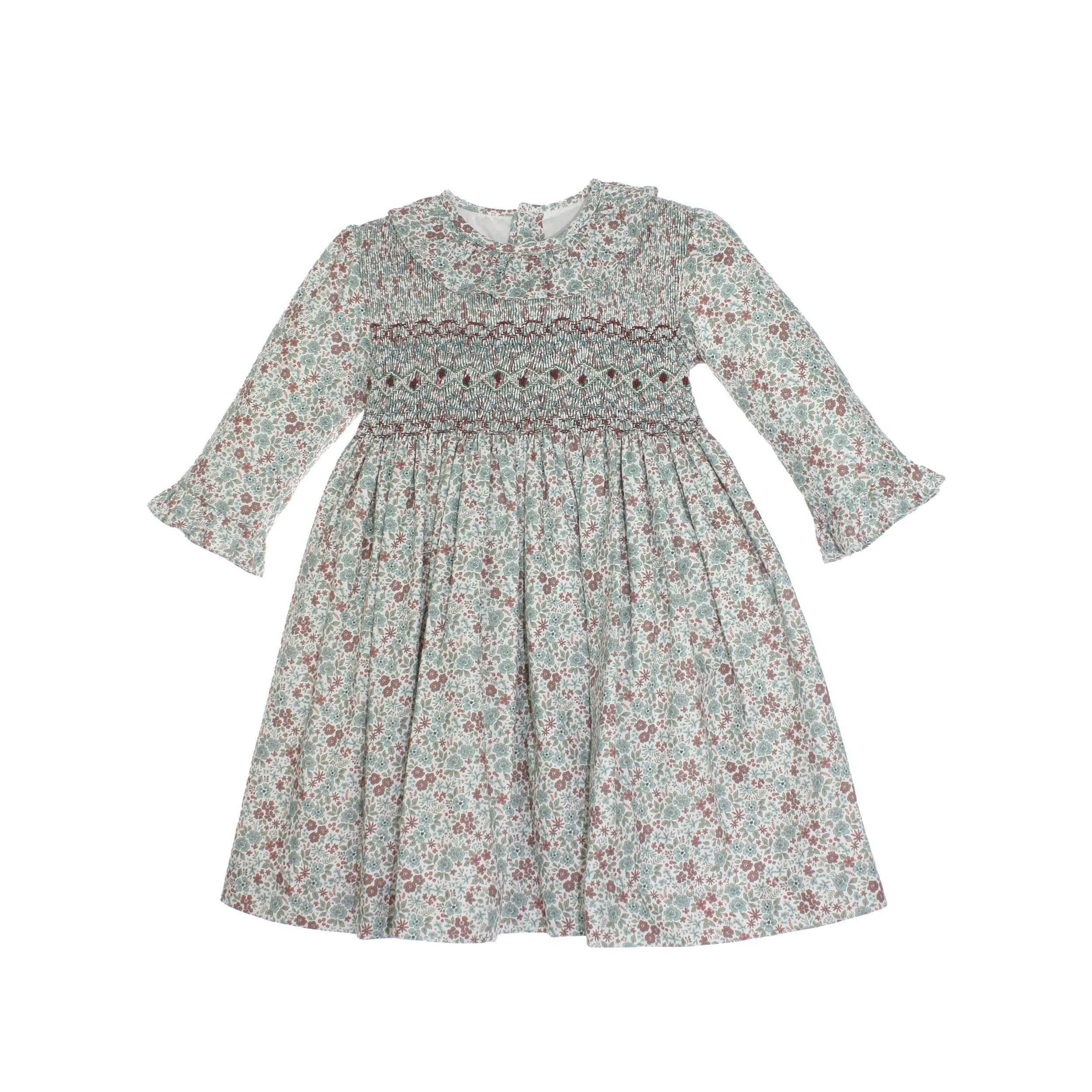 Floral dress with smocked bodice on a white background