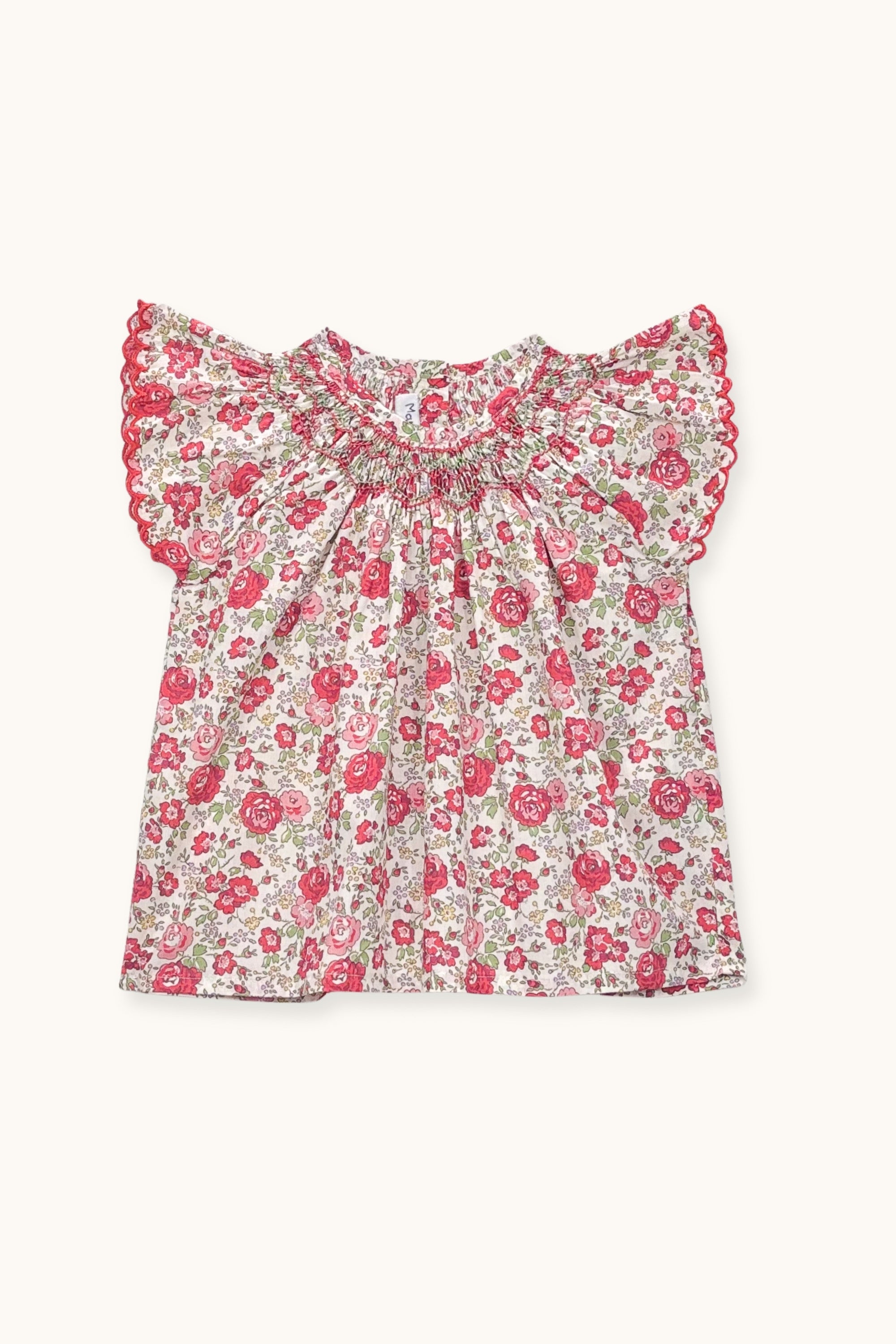 Floral blouse with ruffled sleeves on a white background