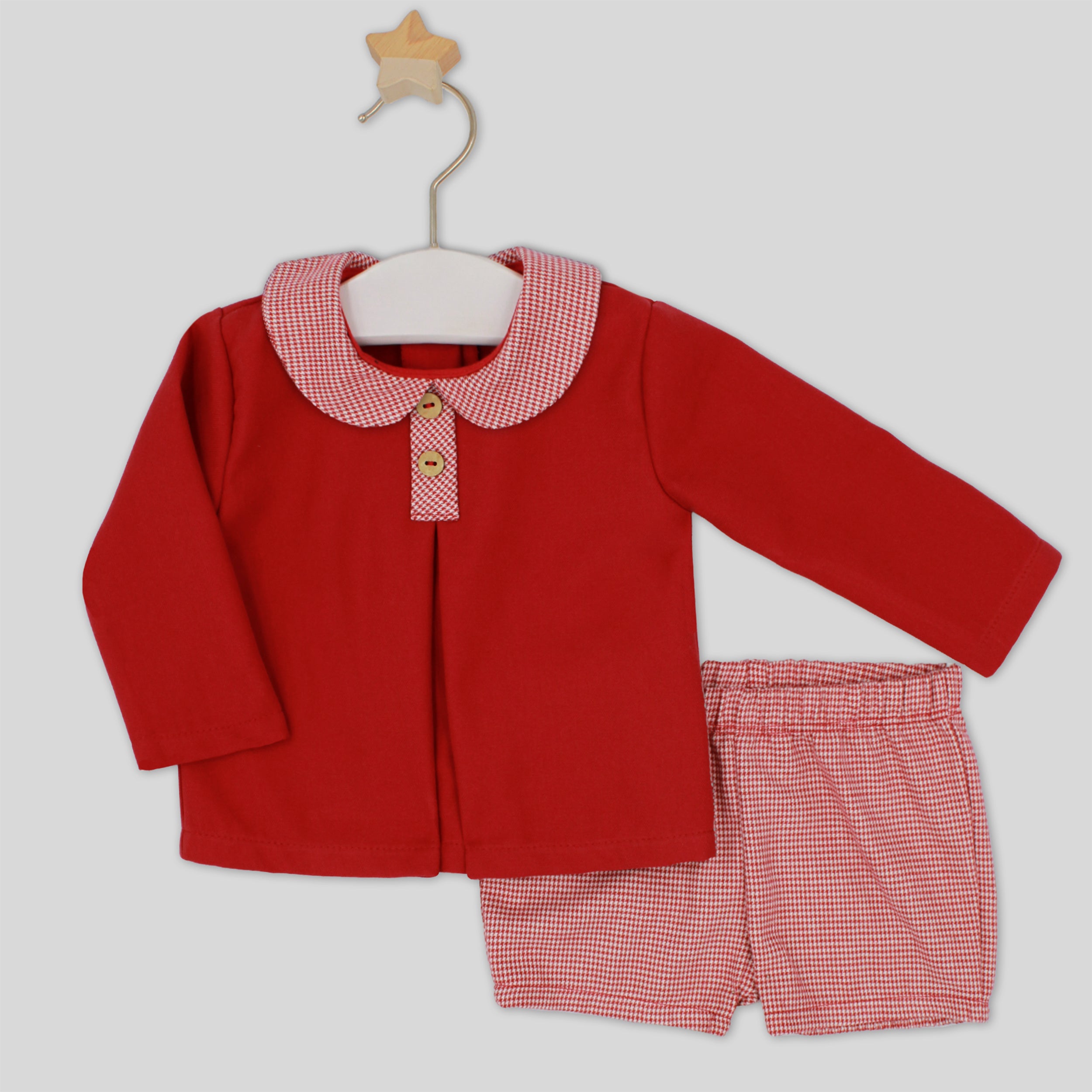 Red children's outfit with checkered collar and shorts on a white background