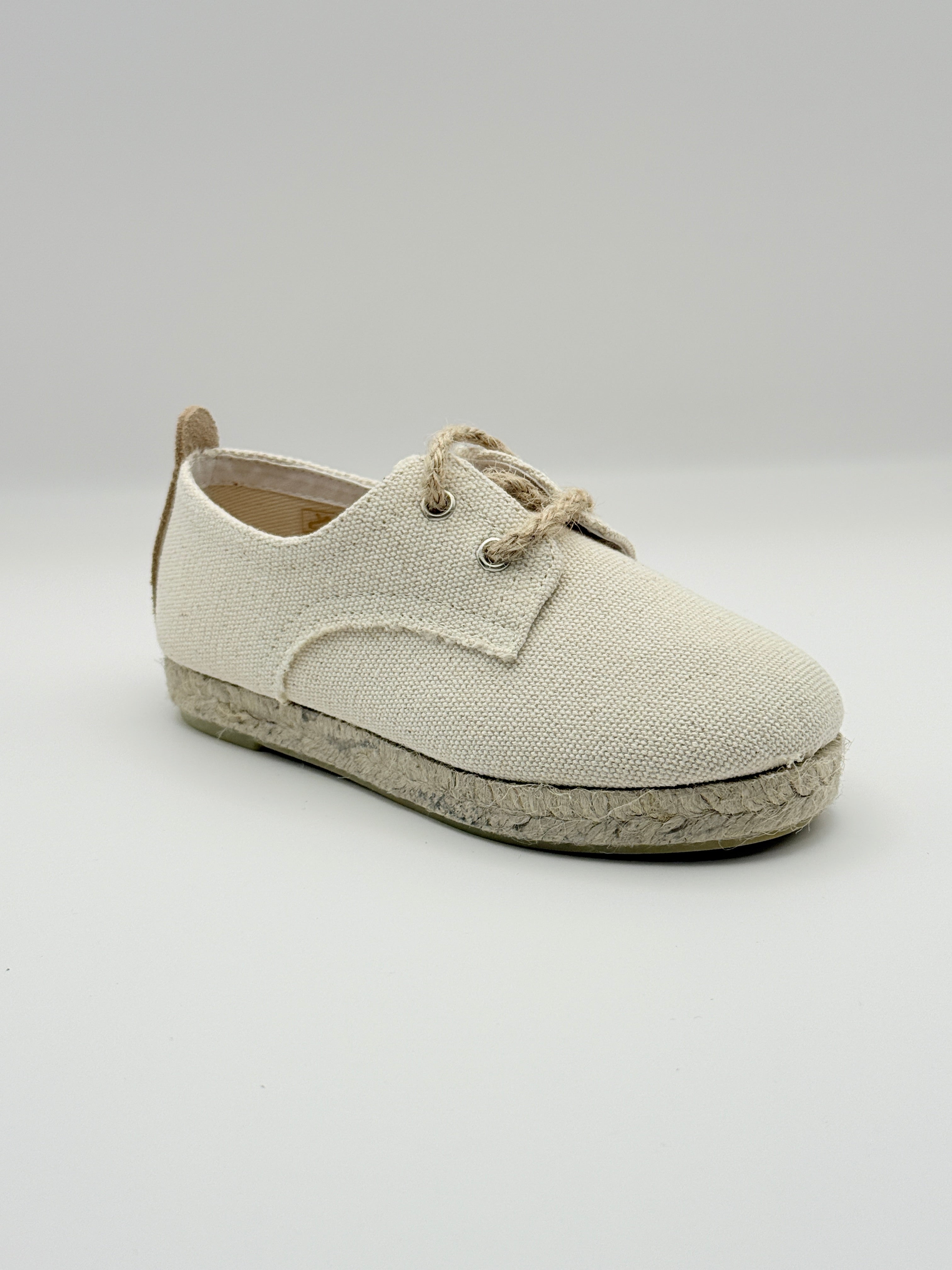 Beige shoe on a light gray background