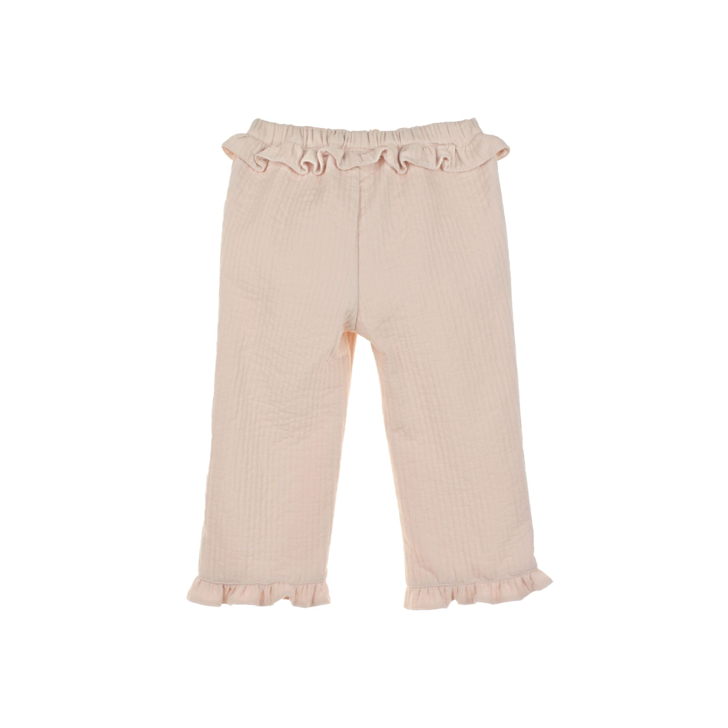 Pink pants with ruffled details on a white background